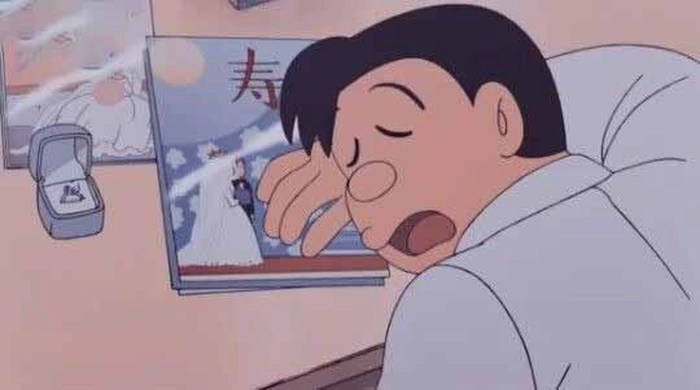 Ảnh Nobisuke Nobi đang đọc báo